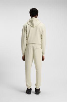 HUGO x RB cotton-terry tracksuit bottoms with bull graphic, Light Beige