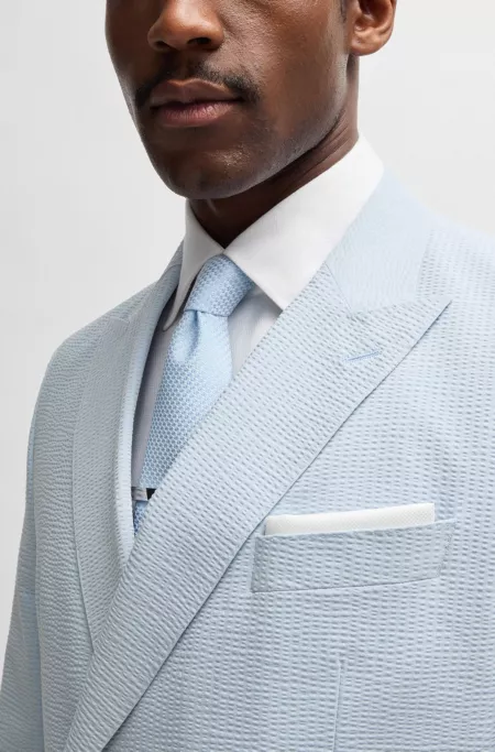 Double-breasted suit in stretch seersucker fabric