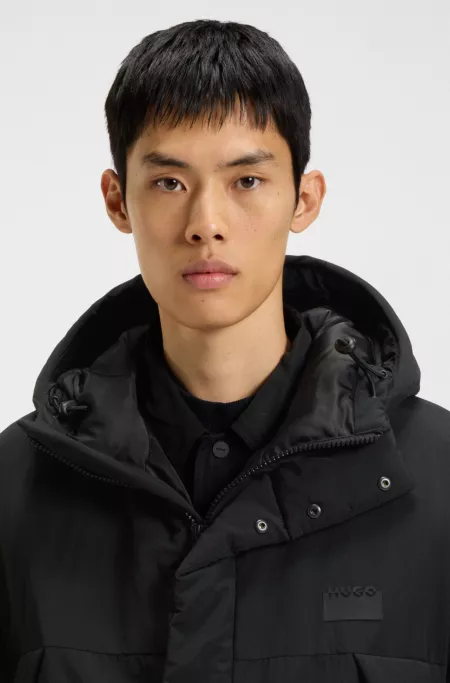Water-repellent hooded puffer coat with split logo