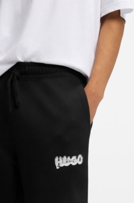 Cotton-terry tracksuit bottoms with logo print, Black
