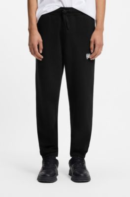 Cotton-terry tracksuit bottoms with logo print, Black