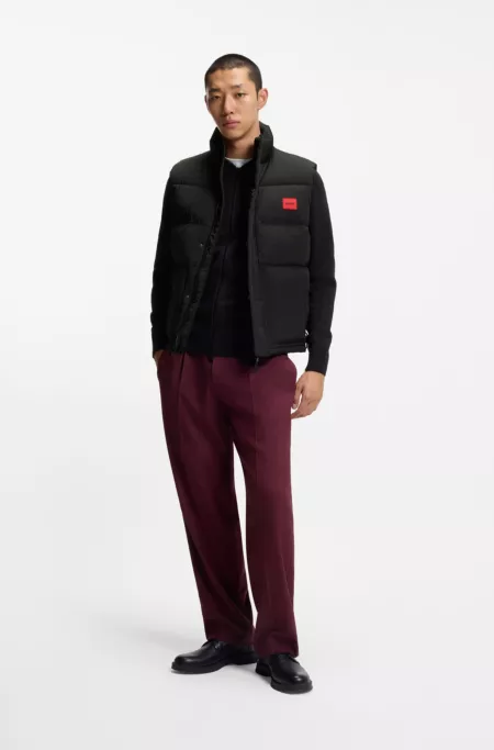 Water-repellent gilet with logo badge