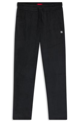 Ribbed-velvet tracksuit bottoms with stacked logo label, Black