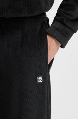 Ribbed-velvet tracksuit bottoms with stacked logo label, Black