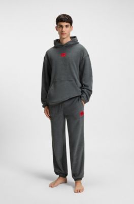 Relaxed-fit fleece tracksuit bottoms with red logo label, Dark Grey