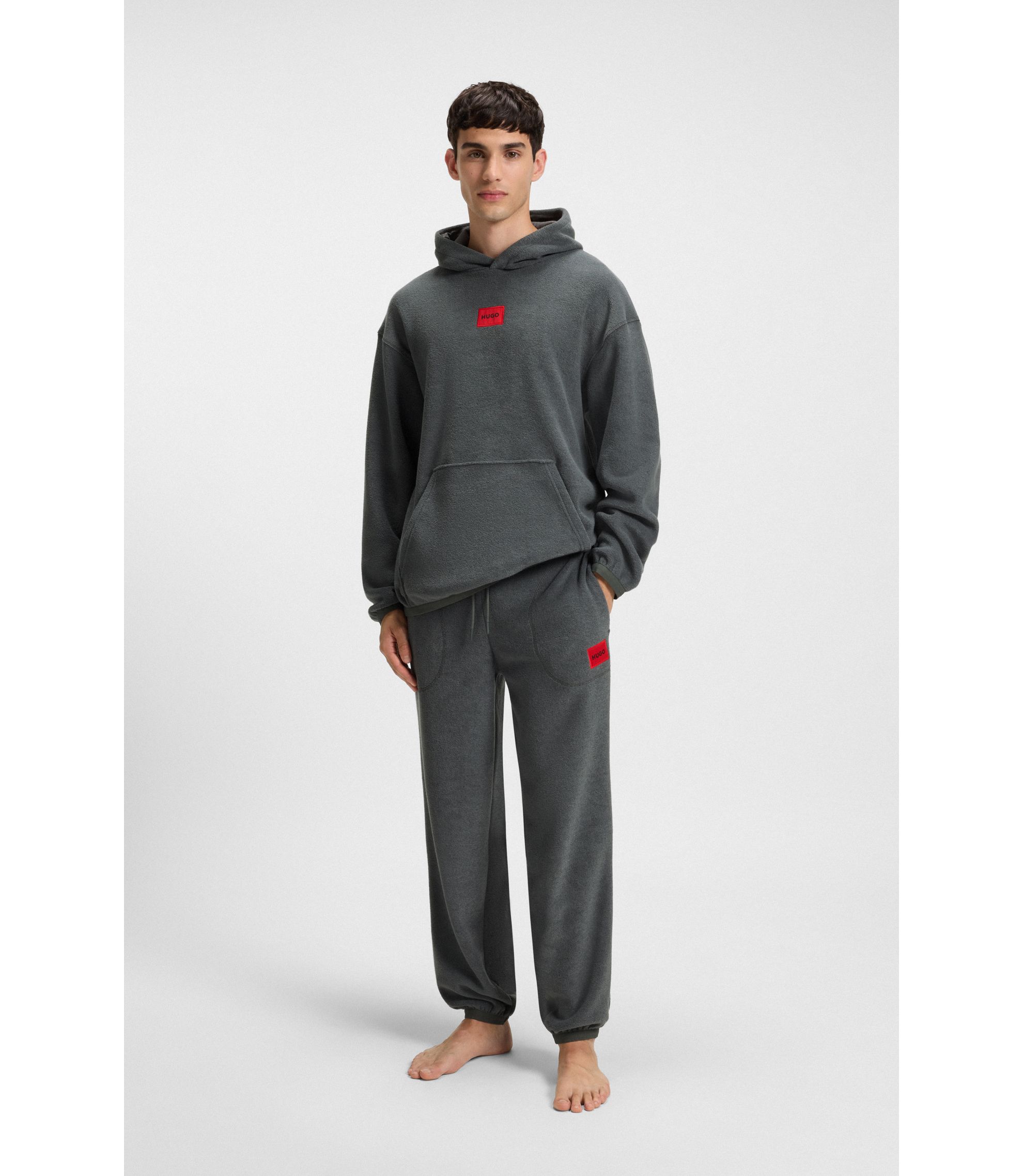 HUGO - Relaxed-fit fleece tracksuit bottoms with red logo label