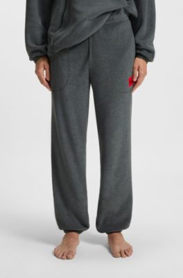 Relaxed-fit fleece tracksuit bottoms with red logo label, Dark Grey