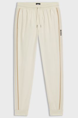 Cotton-terry tracksuit bottoms with tape and logo, Natural