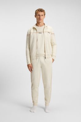Cotton-terry tracksuit bottoms with tape and logo, Natural