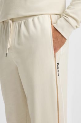 Cotton-terry tracksuit bottoms with tape and logo, Natural