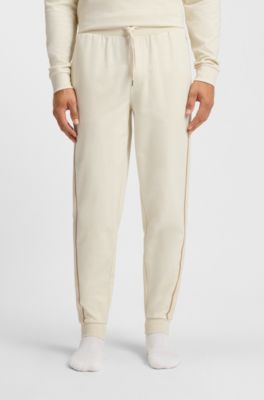 Cotton-terry tracksuit bottoms with tape and logo, Natural