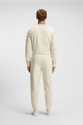 Cotton-terry tracksuit bottoms with tape and logo, Natural