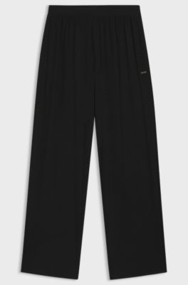 Monogram-print pyjama bottoms with logo plate, Black