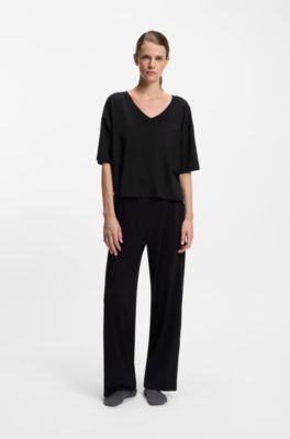 Monogram-print pyjama bottoms with logo plate, Black