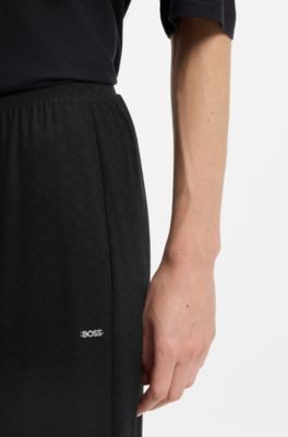 Monogram-print pyjama bottoms with logo plate, Black