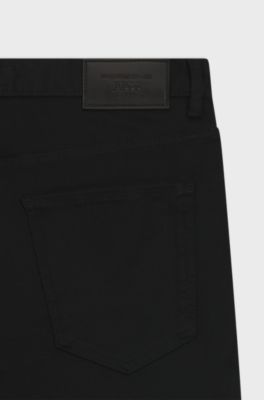 Porsche x BOSS-jeans med tapered fit i sort denim med str&aelig;k, Sort