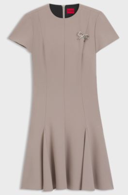Godet-insert dress with bow brooch, Light Beige
