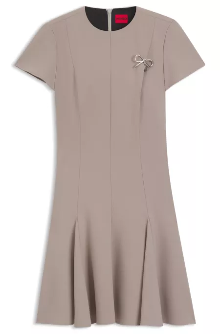 Godet-insert dress with bow brooch