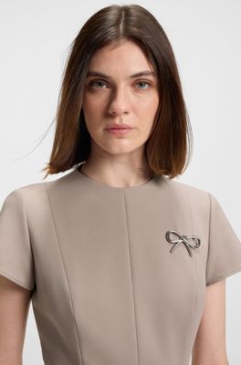 Godet-insert dress with bow brooch, Light Beige