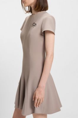 Godet-insert dress with bow brooch, Light Beige