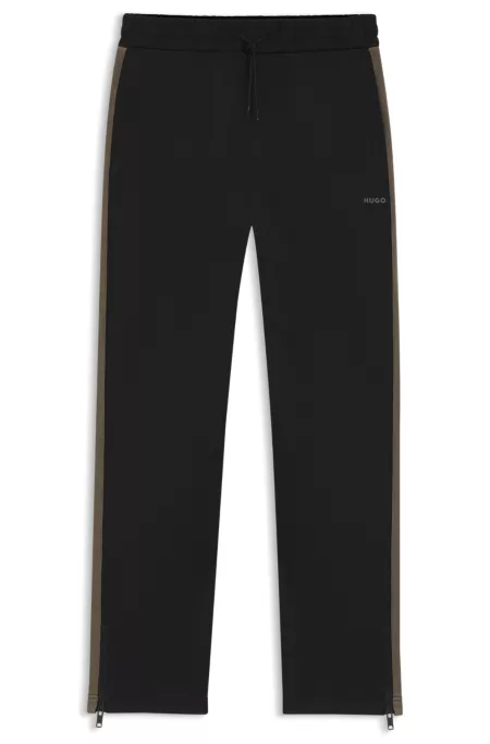 Relaxed-fit tracksuit bottoms with logo tape
