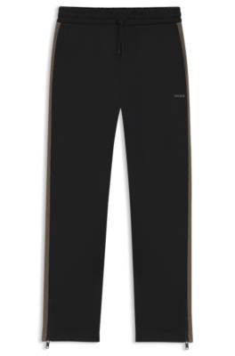 Relaxed-fit tracksuit bottoms with logo tape 1