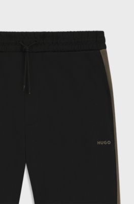 Relaxed-fit tracksuit bottoms with logo tape, Black