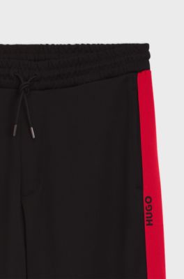 Relaxed-fit tracksuit bottoms with logo tape, Black
