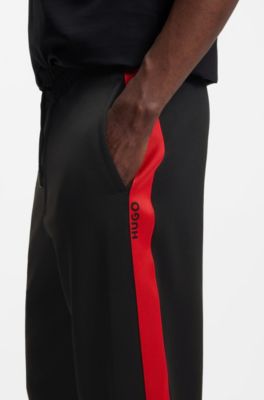 Relaxed-fit tracksuit bottoms with logo tape, Black