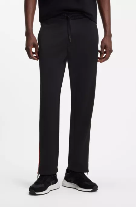 Relaxed-fit tracksuit bottoms with logo tape