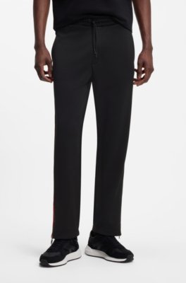 Relaxed-fit tracksuit bottoms with logo tape