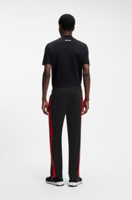 Relaxed-fit tracksuit bottoms with logo tape, Black