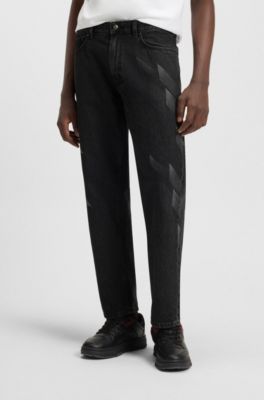 HUGO x RB Relaxed-Fit Jeans mit gelasertem Muster, Schwarz