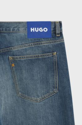 Jeans baggy fit in denim blu a filo irregolare, Blu scuro