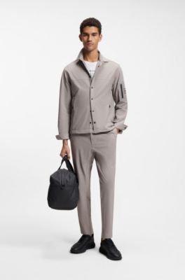 Tapered-fit trousers in waffle-structured stretch fabric, Grey