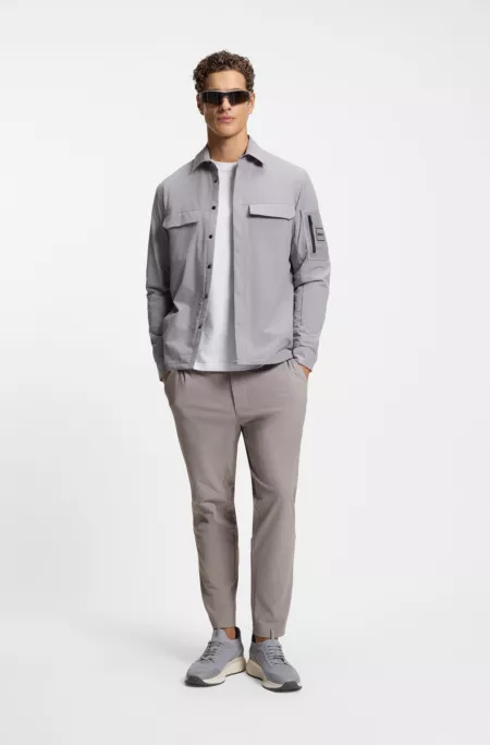 Tapered-fit trousers in waffle-structured stretch fabric