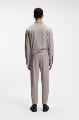 Tapered-fit trousers in waffle-structured stretch fabric, Grey