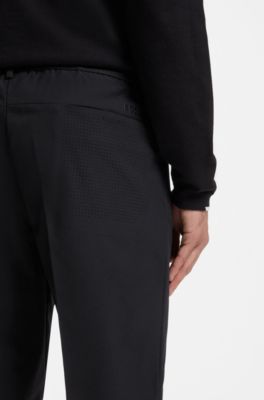 Tapered-fit trousers in water-repellent fabric, Black