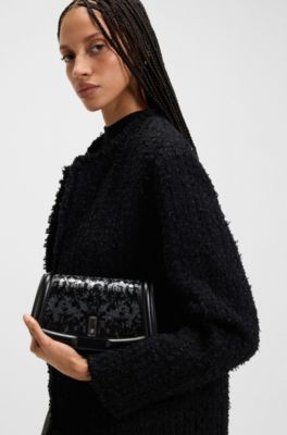 Ariell leather clutch bag with sequin embellishments, Black