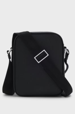 Reporter bag in plain and textured leather, Black