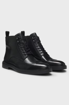 Boots aus Leder mit Budapester-Details, Schwarz