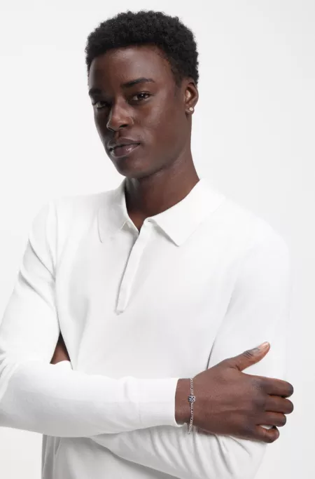 Chain cuff with stacked-logo plaque