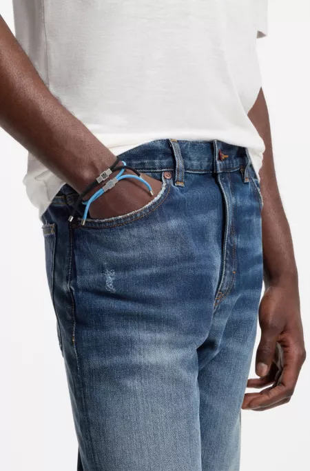 Two-pack of cord cuffs with logo plaques