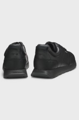 Running-inspired trainers in faux leather with structured details, Black