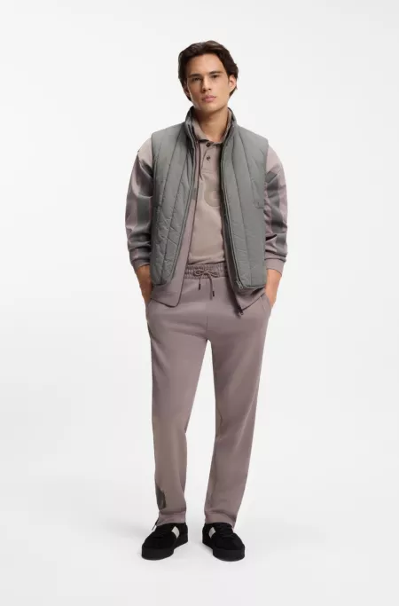 Vertical-quilted gilet with logo detail