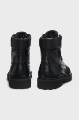 Leather boots with cushioned collar and lug sole, Black