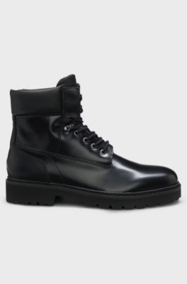Leather boots with cushioned collar and lug sole, Black