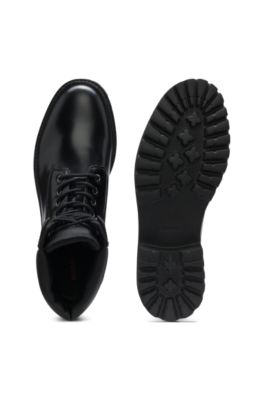 Leather boots with cushioned collar and lug sole, Black