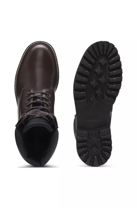 Leather boots with cushioned collar and lug sole