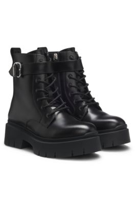 Faux-leather boots with buckled strap, Black